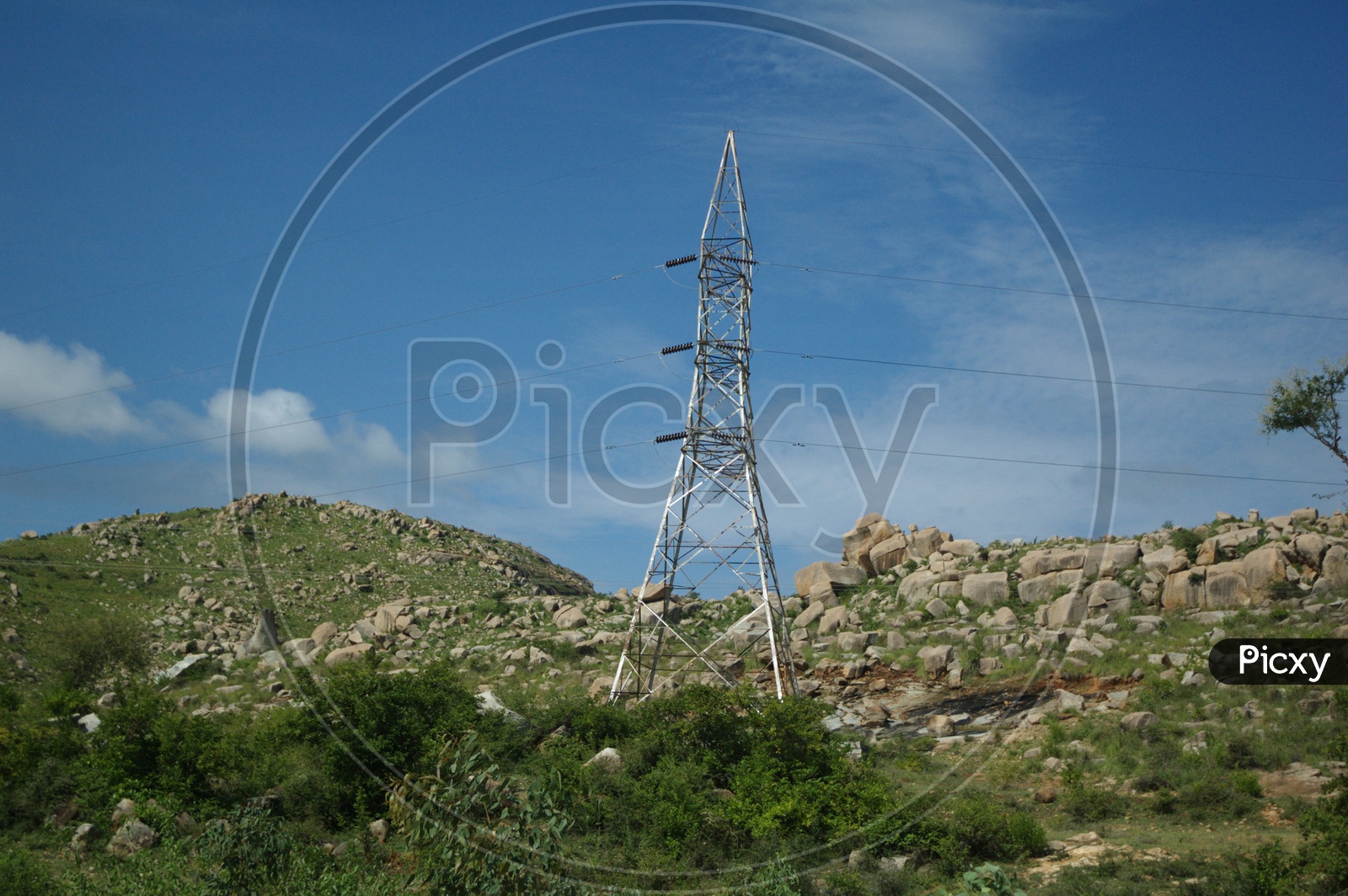 Electrical power transmission line on a hill