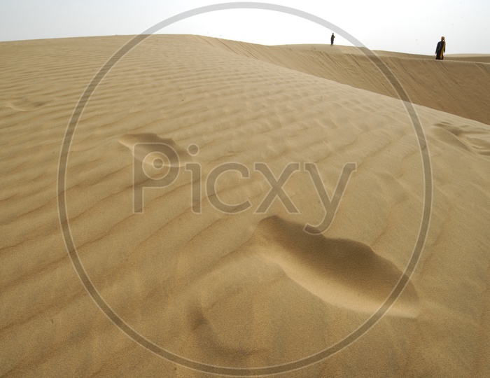 Wave Like Patterns on Desert Sand Dunes