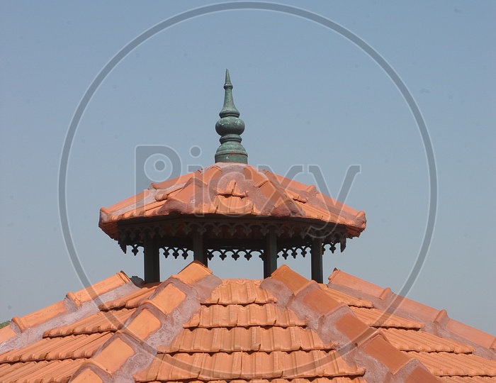 Guttertiled roof alongside a dome
