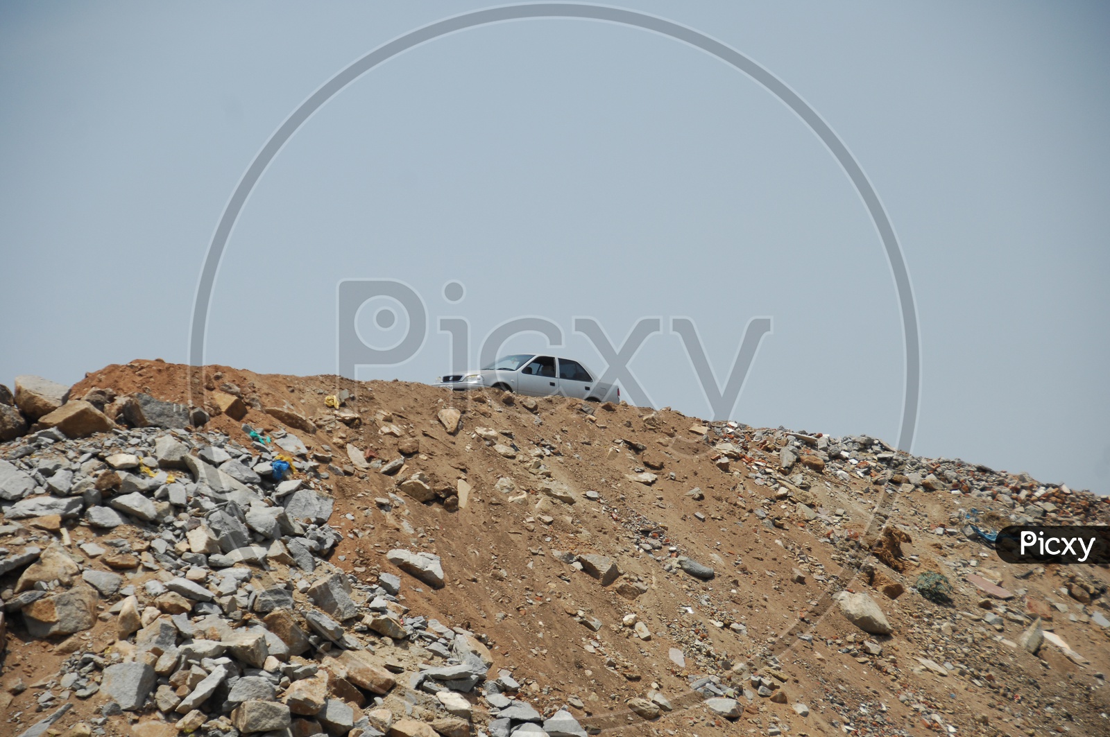 A stationary car on the top of a cliff