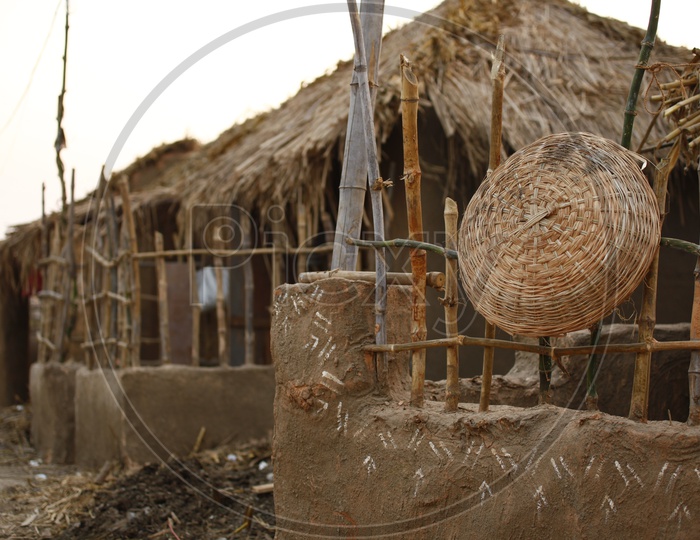 Bamboo woven basket on a boundary wall