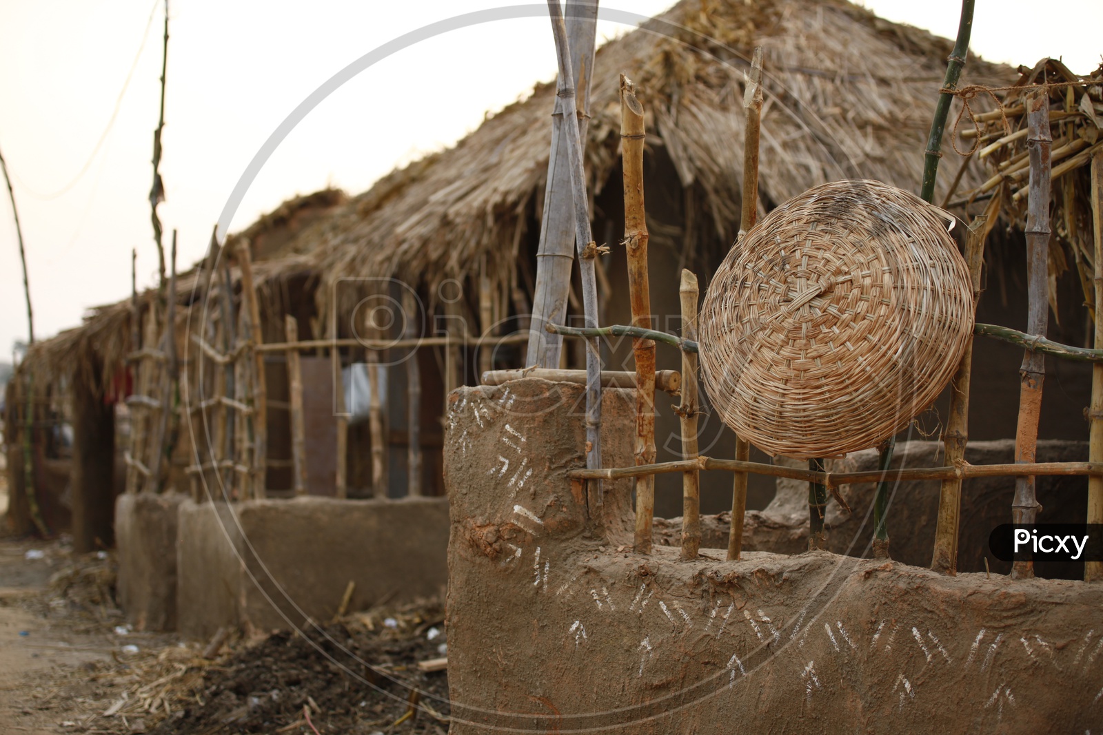 Bamboo woven basket on a boundary wall
