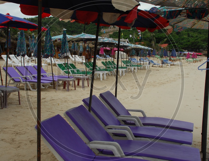 Pool chairs and umbrellas on the seashore