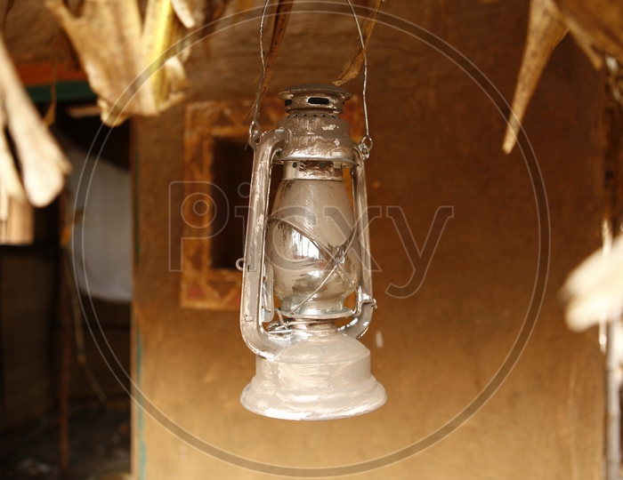 Kerosene Lantern Hanging In a Hut