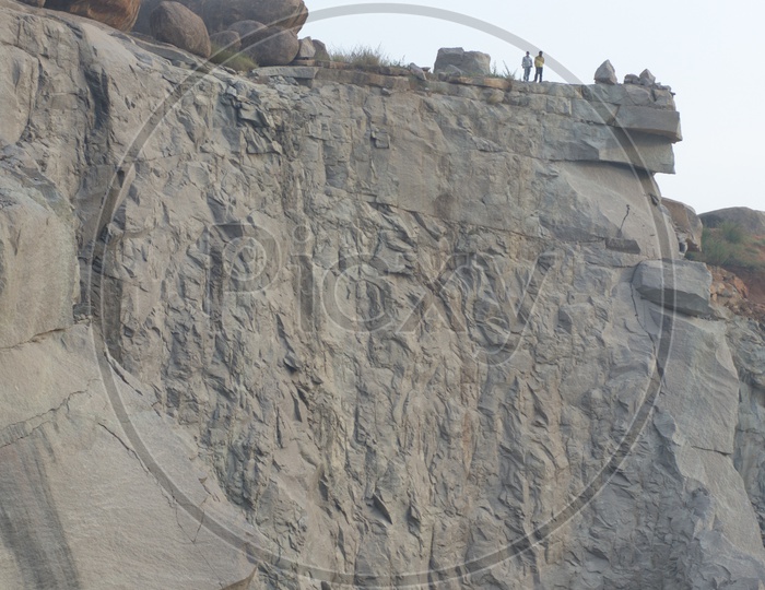 Two men standing on top of the Granite Quarry