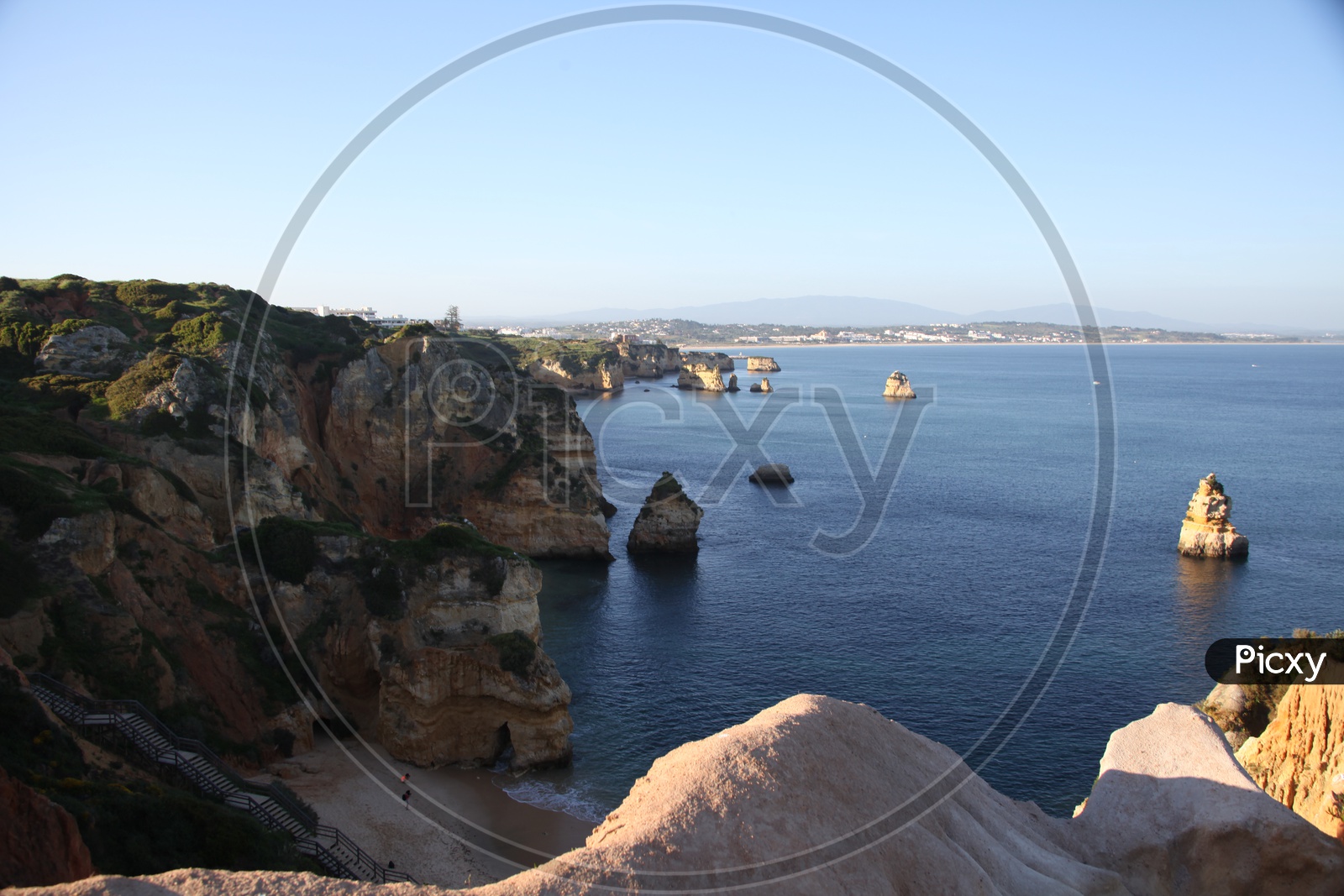 aerial view of ponta da piedade from the top of a cliff