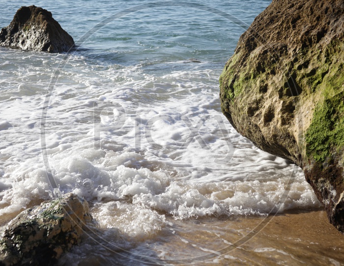sea water touching the rocks in the  beach