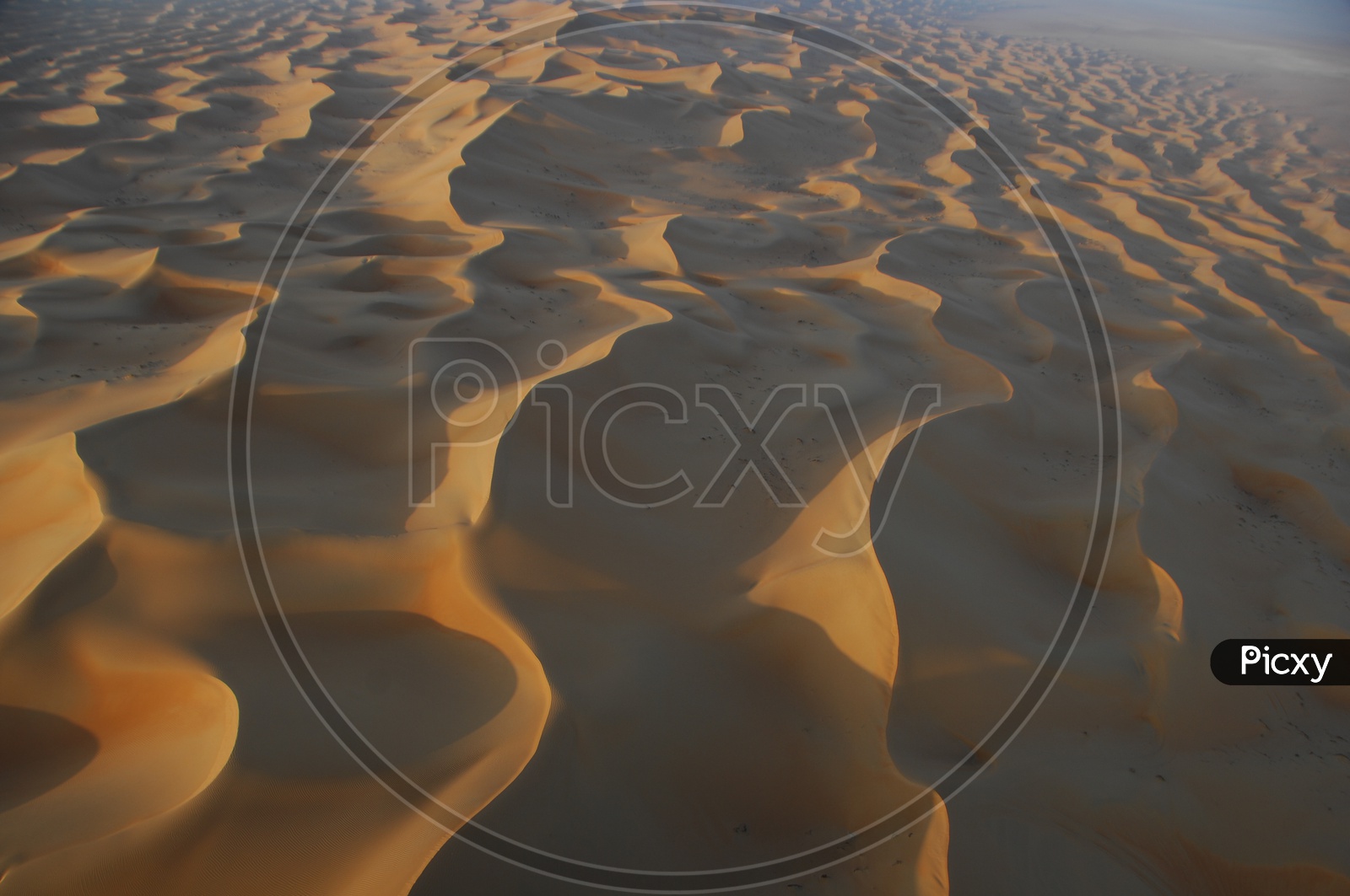 Wave Like Patterns On Desert Sand