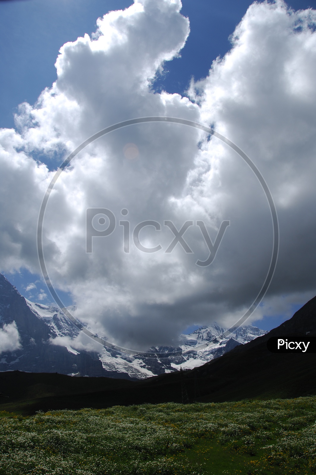 Cumulus Clouds alongside the Bernese Alps