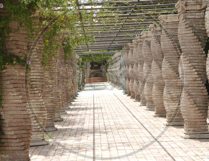 Walkway with pillars on either side