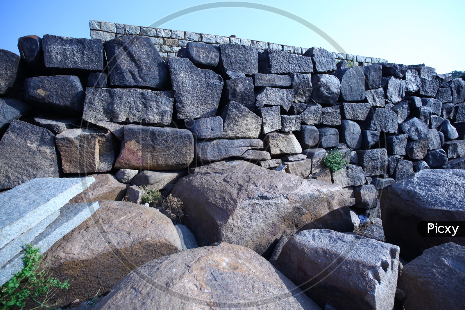 a wall built with black rocks