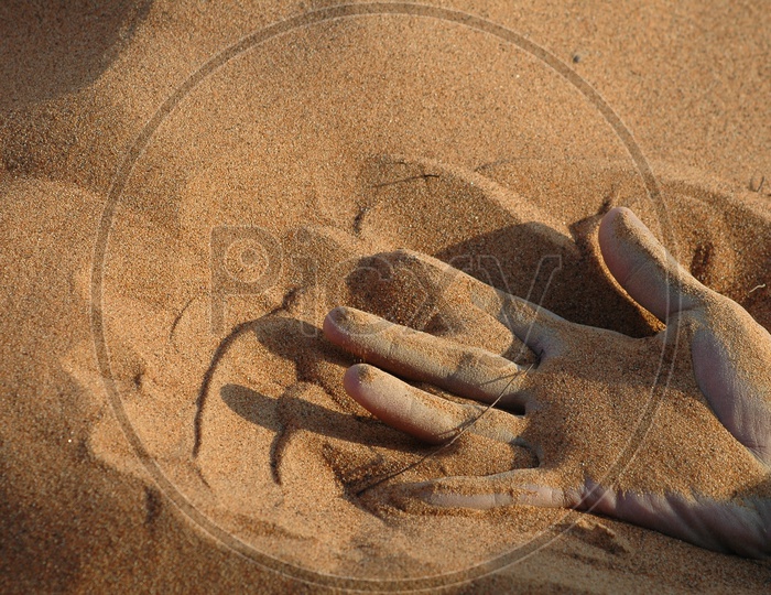 Hand on the sand