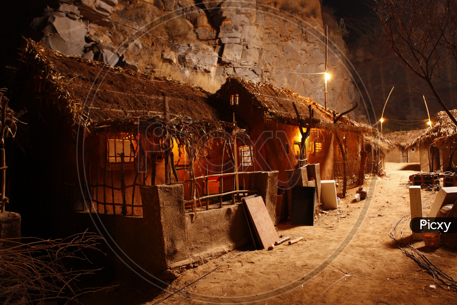 Image of Thatched mud houses in a village during nightML849928Picxy