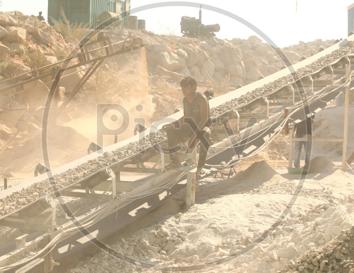 A worker in a stone crusher plant