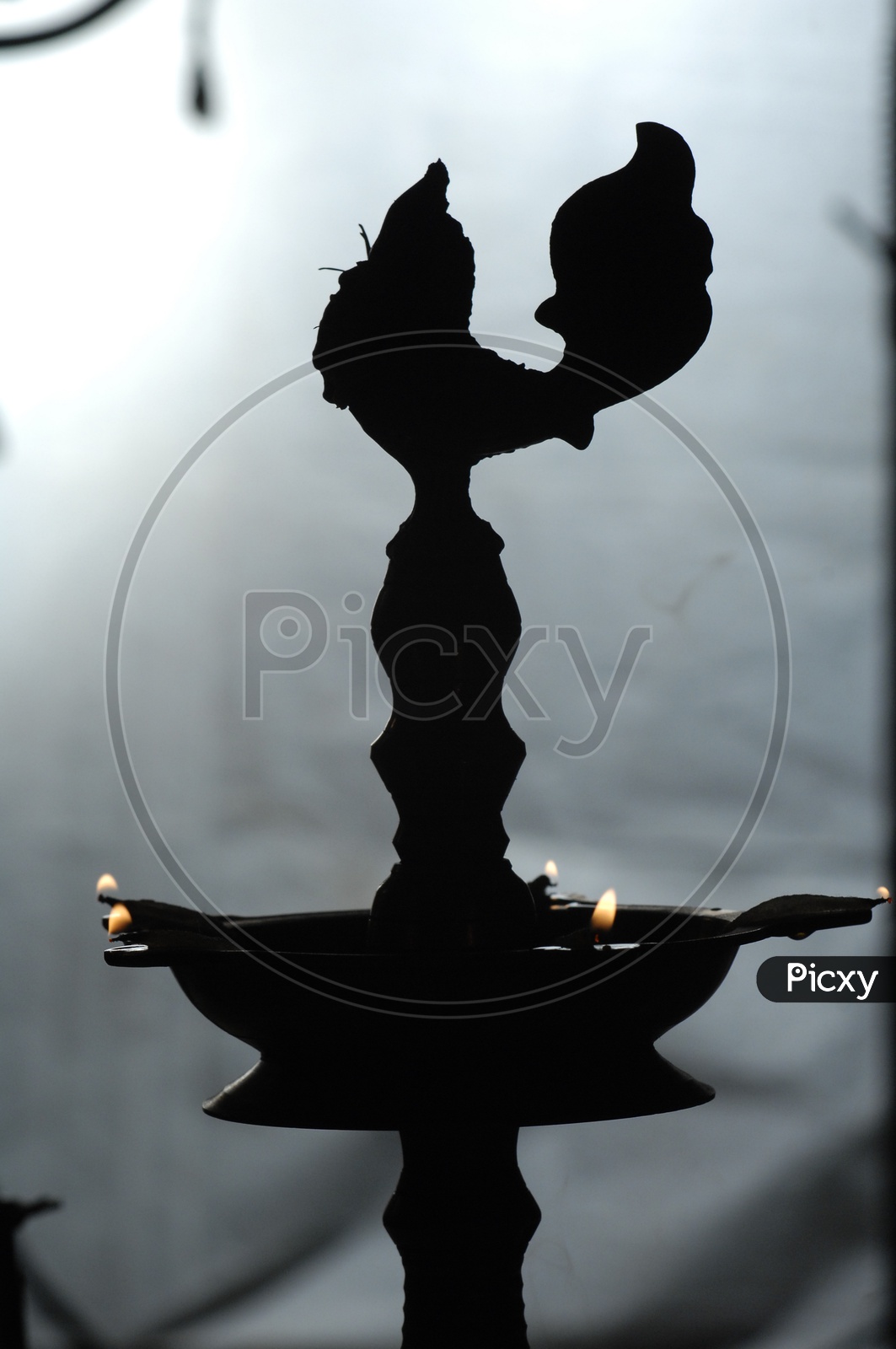 Silhouette of an oil lamp diya