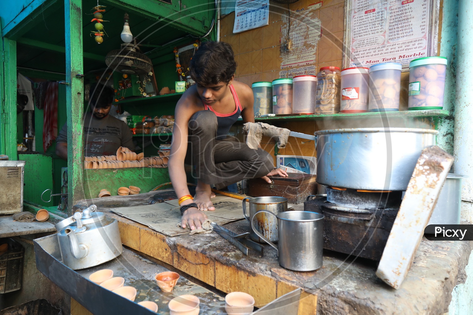 Indian Young Boy at a Tea Vendor Stall
