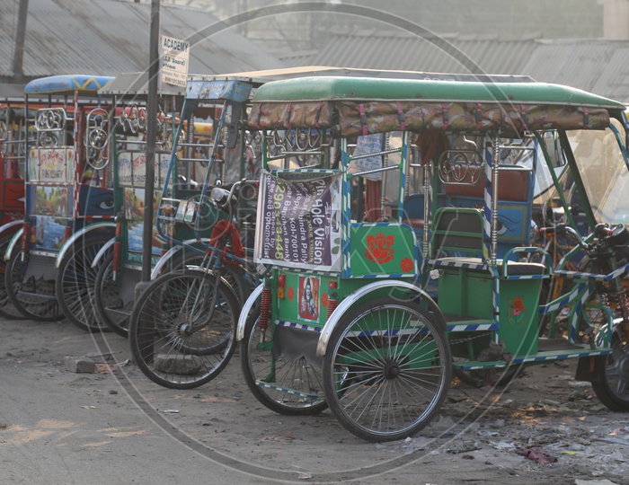 Tricycle Autos in a  Stand