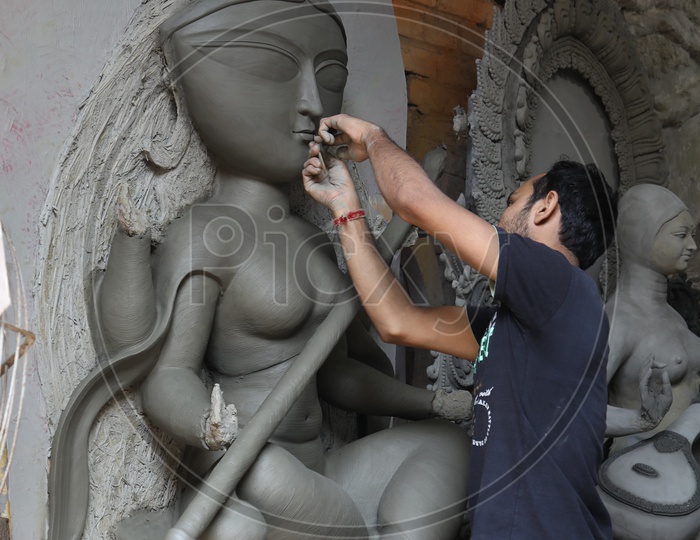 A Sculptor Making The Hindu Goddess Clay idols