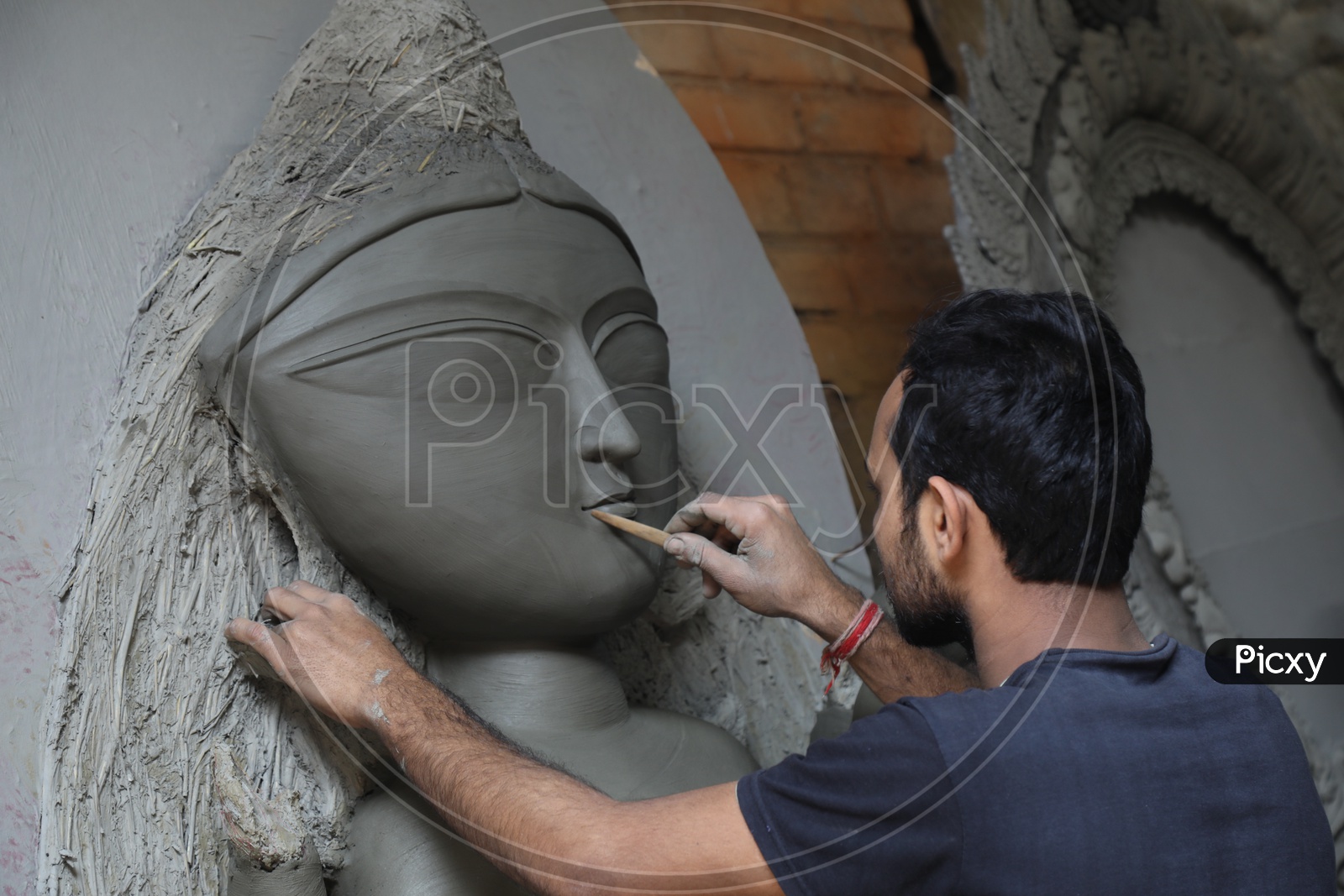 A Sculptor Making Goddess Durga Clay Idols