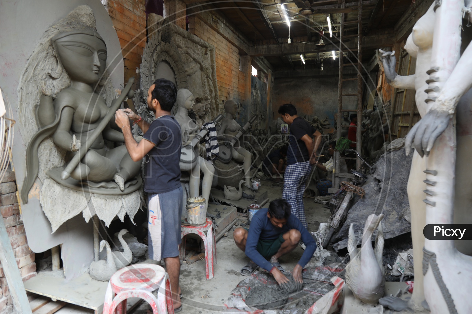 A Sculptor in Making Of Hindu Goddess Clay Idols