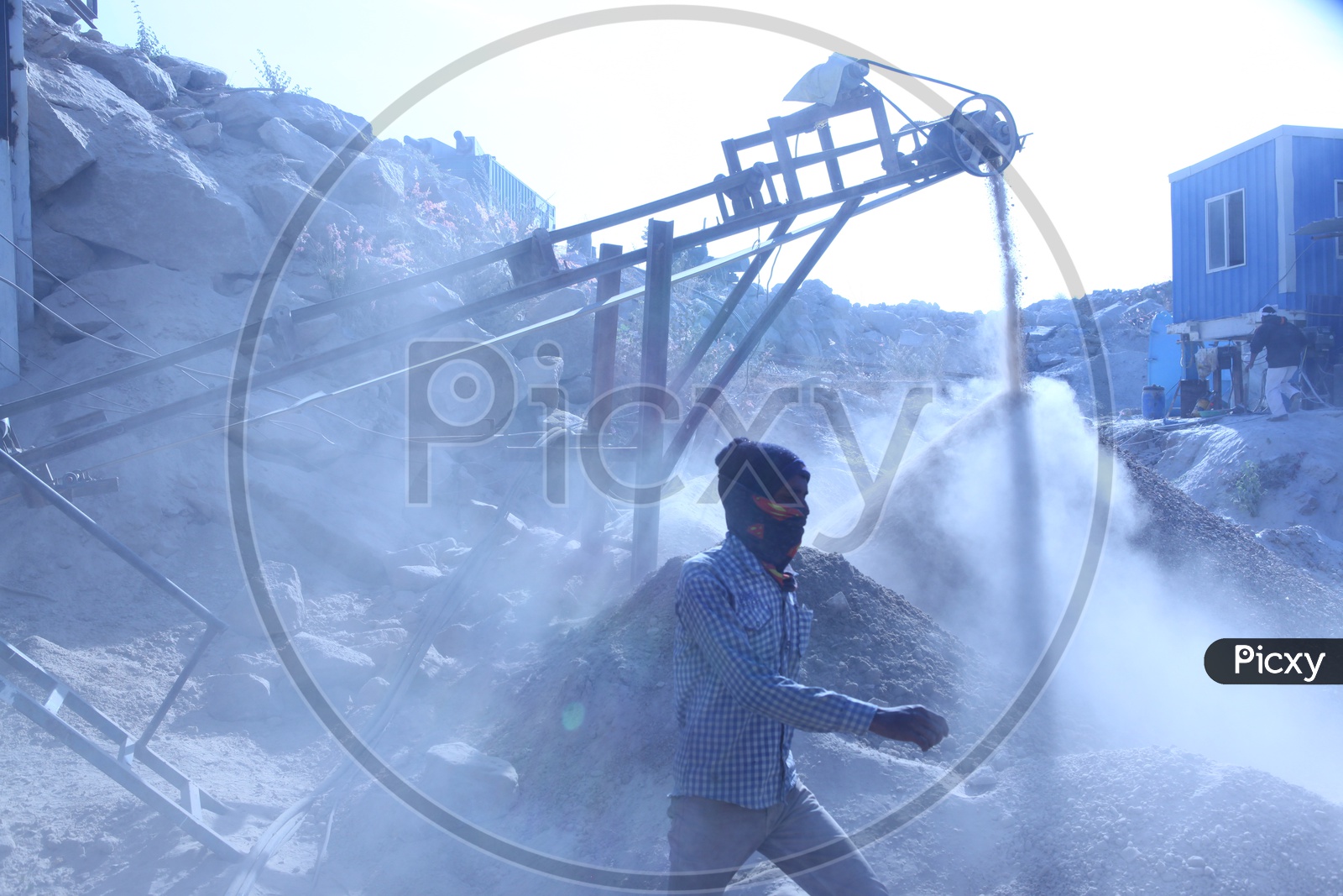 Worker at stone crusher plant