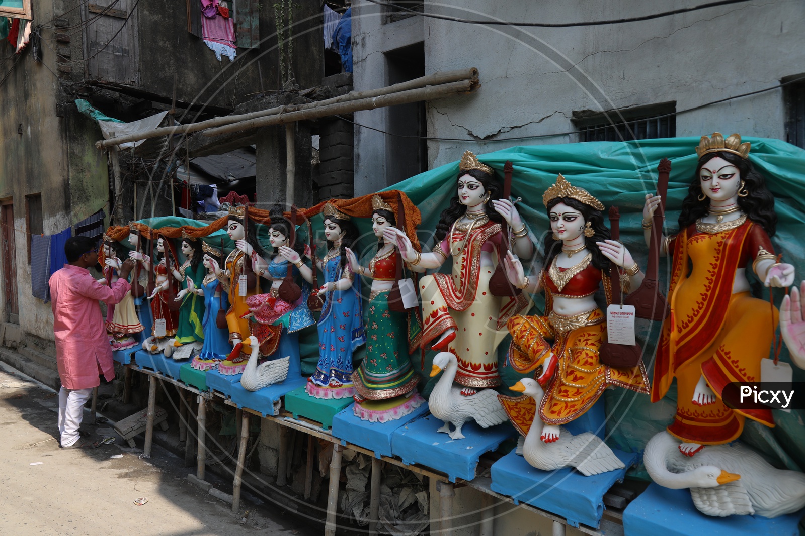 An Artist Giving Final Detailing For Hindu Goddess Idols