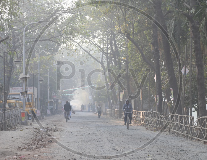 Locals Riding Bicycles On the Streets in Early Mornings