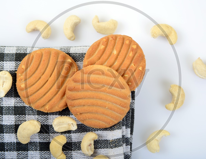Sweet cookies or biscuits and nutritious cashew nuts