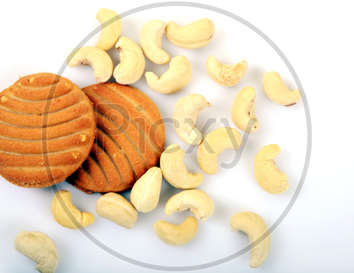 Sweet cookies or biscuits and nutritious cashew nuts