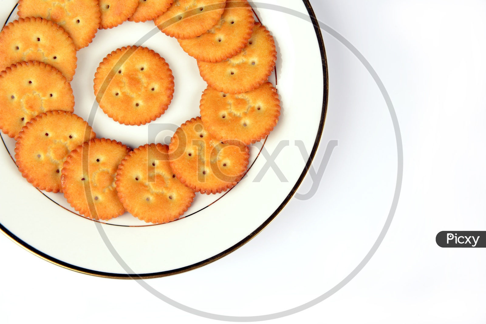 Salty cookies or biscuits  in a plate on White baground