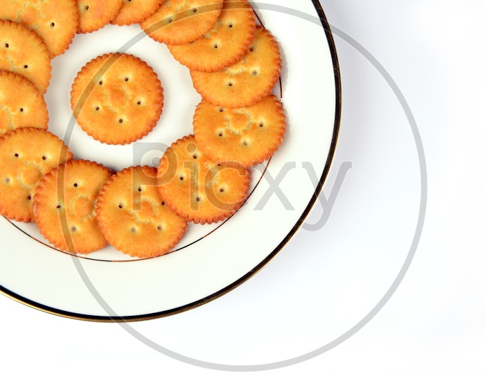 Salty cookies or biscuits  in a plate on White baground