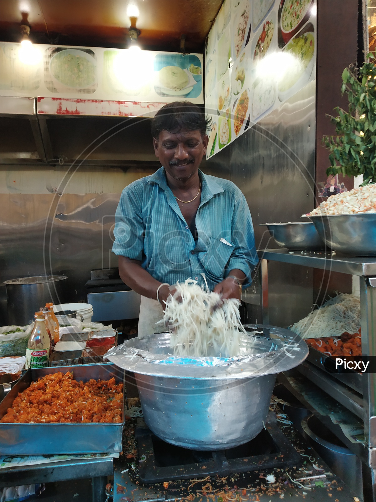Fast Food Vendor preparing the Noodles