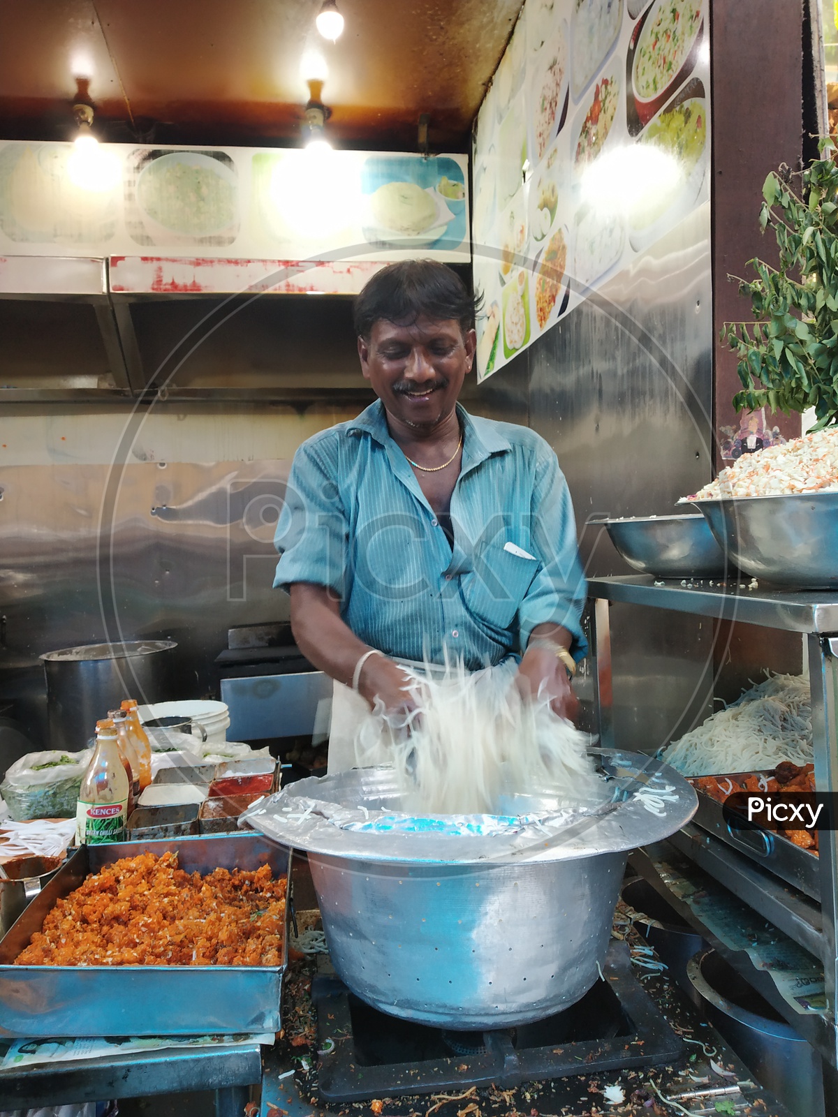 Fast Food Vendor preparing Noodles
