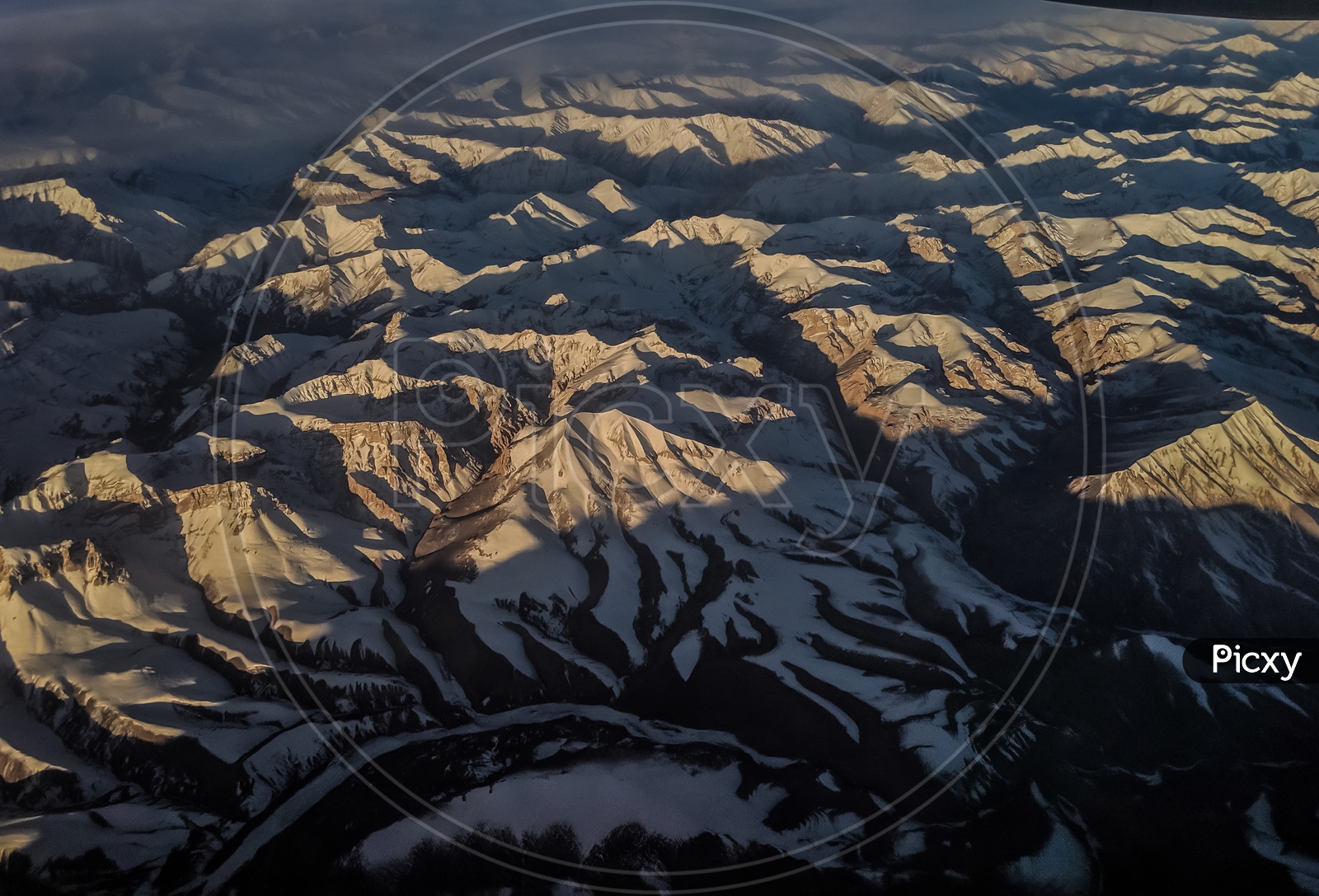 Aerial View of Ice Capped Mountains And  Valley Views