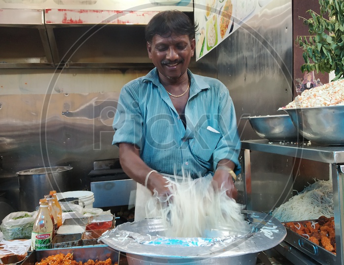 Fast Food Vendor preparing Noodles