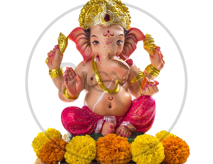 Lord Ganesh Idol with flowers on white background