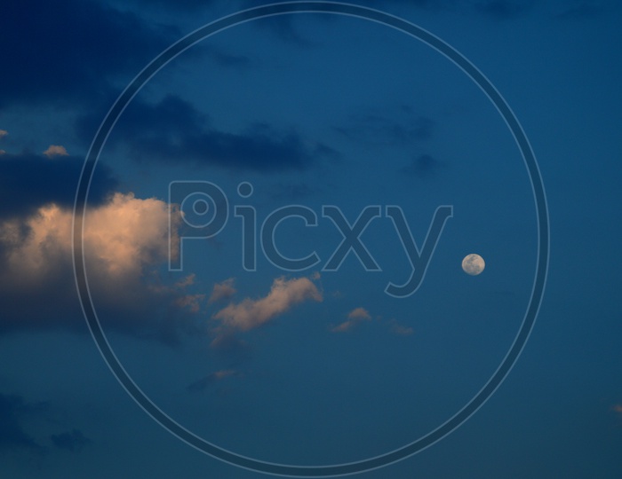 Beautiful sky with clouds and Moon