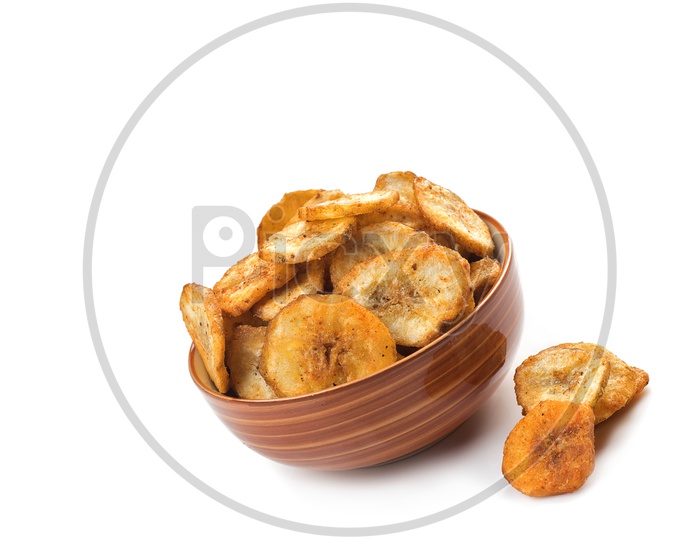 Banana chips in a bowl on a white background