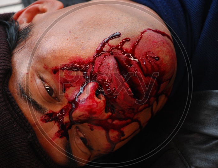 Dead man with blood injuries on face