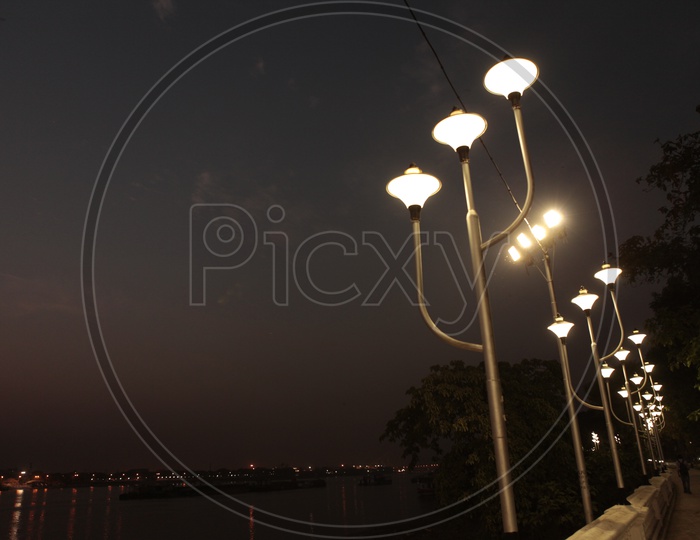 Street lights by the riverside in the night