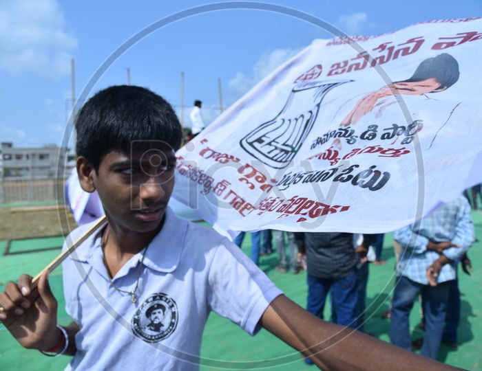 Jana Sena party supporter holding party flag