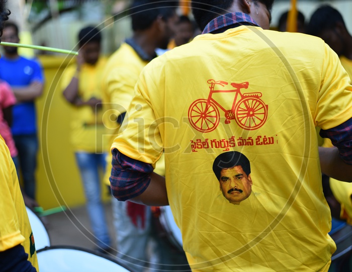 TDP party supporters wearing party t-shirts at an election campaign rally