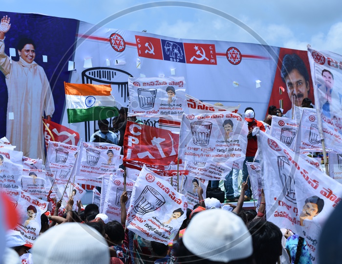 Jana sena supporters holding party flags at an election campaign in Amalapuram