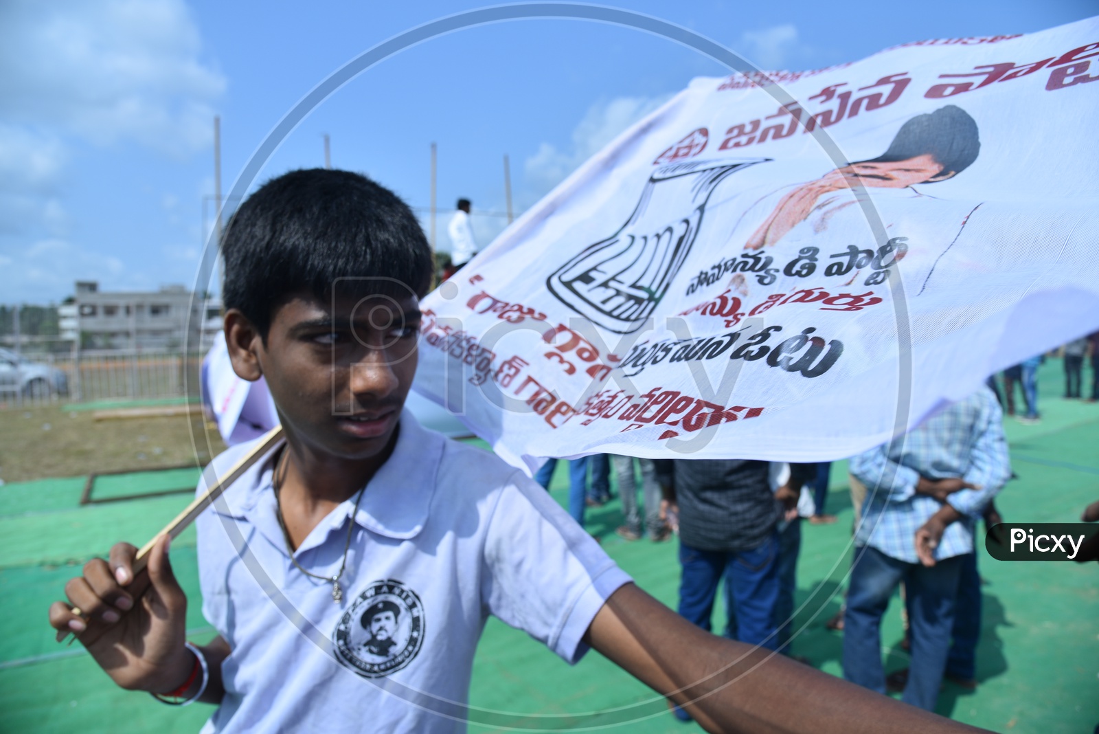 Jana Sena party supporter holding party flag