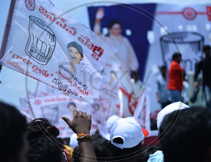 Jana sena party supporters holding the party flags at an election campaign in Amalapuram