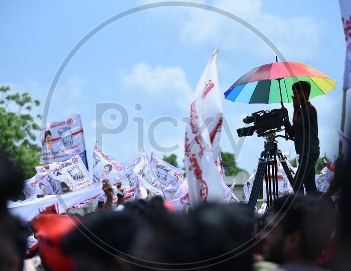 A videographer shooting the Jana Sena party election campaign event in Amalapuram