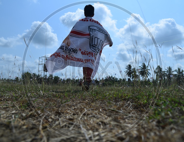 Jana sena party supporter holding party banner