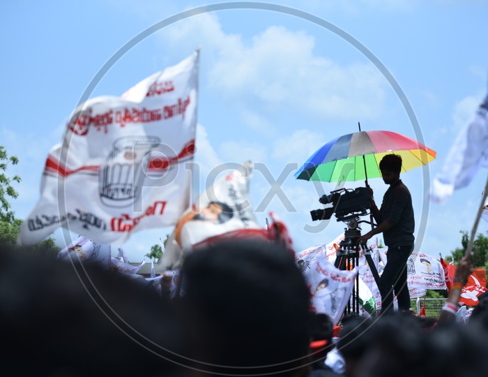 A videographer shooting the Jana Sena party election campaign event in Amalapuram