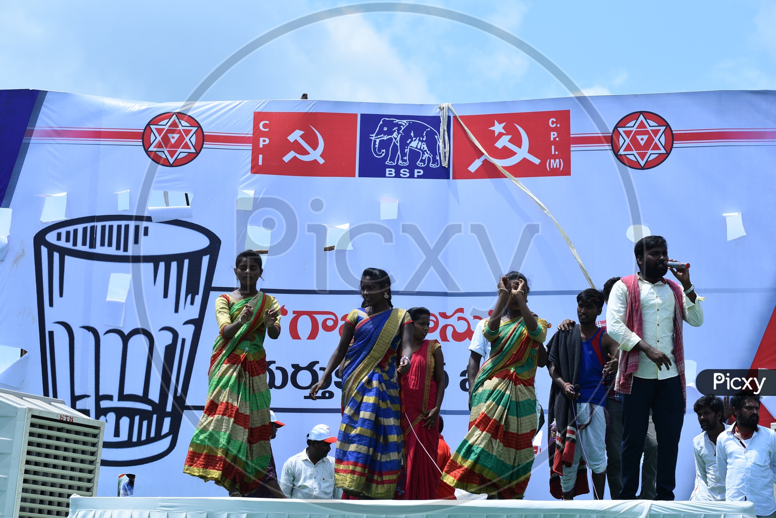 Artists performing folk dance on the stage at Jana sena party election campaign