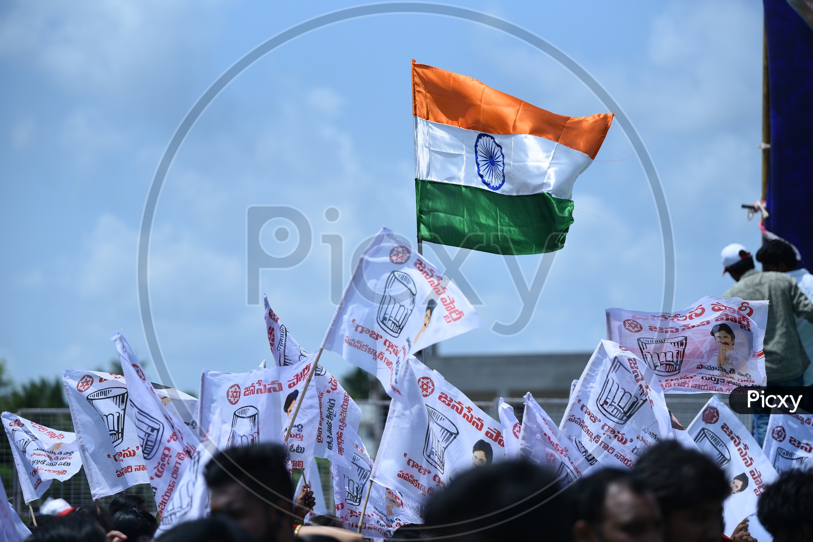 Jana Sena party logo and "Glass tumbler" symbol on flags